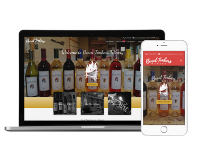 An exeplore web design project mockup image showcasing Burnt Timbers Winery of Granville's completed website on a laptop and a smart phone. The image has a colorful background and text saying Website Launch followed by the website address of the completed project.